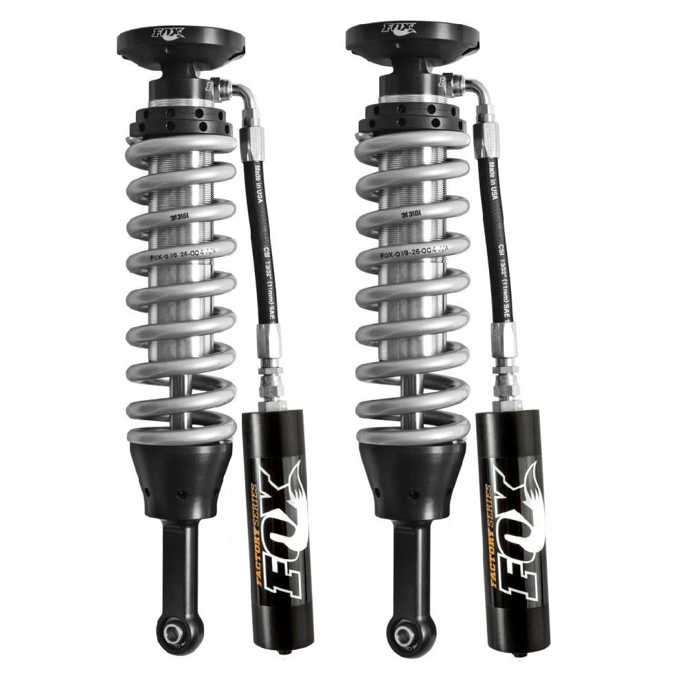 A pair of Fox Racing shock absorbers with seamless steel bodies on a white background.