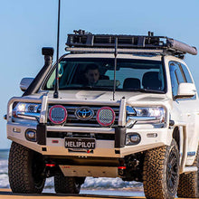 Load image into Gallery viewer, A white ARB Alloy Flat Rack With Mesh 87”X 44” for Toyota Land Cruiser 200 Series 2008 - 2020 is parked on the beach.
