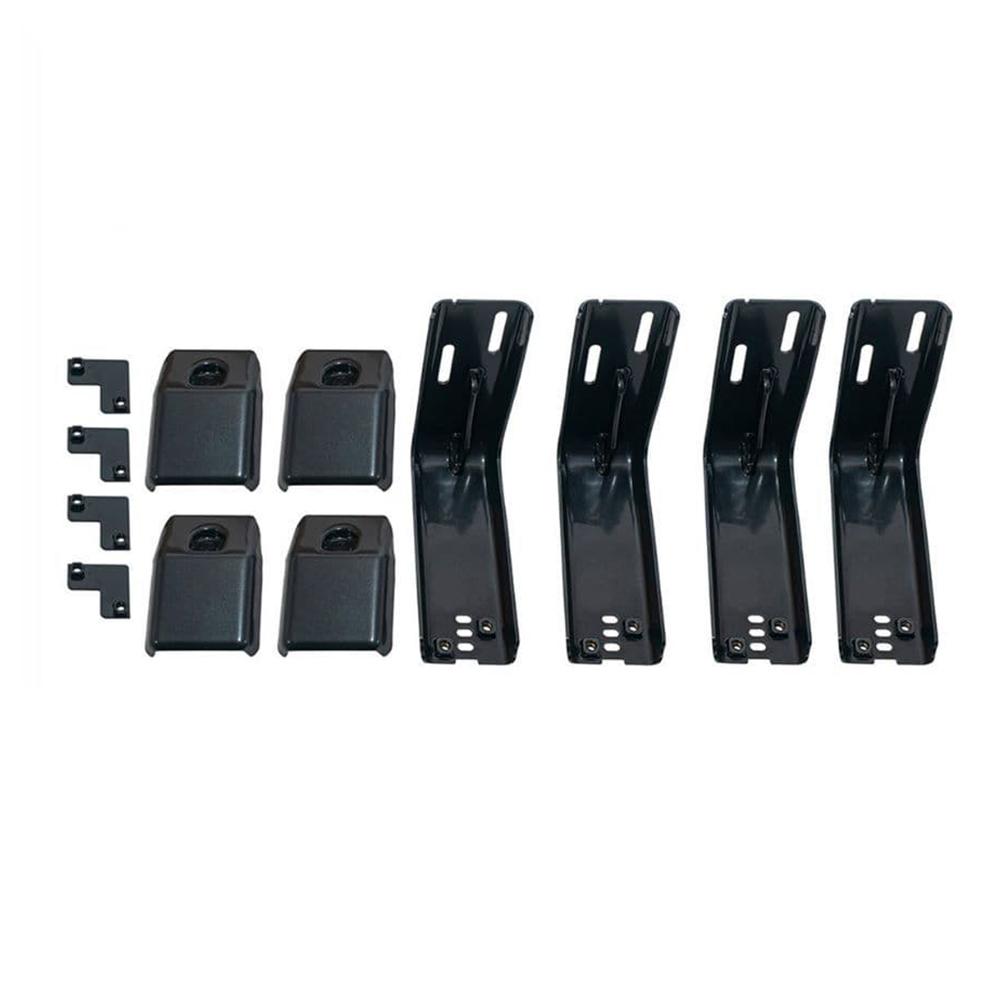 A high capacity ARB Roof Rack Fitting Kit 3700060 (43”x44”) of black plastic brackets for secure storage in a vehicle.