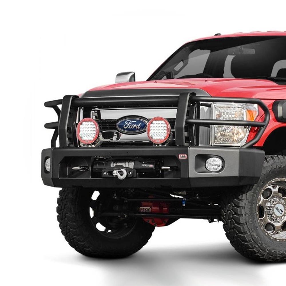 A red ARB Ford F-250 pickup truck with a front bumper featuring larger tubing and winch compatibility.