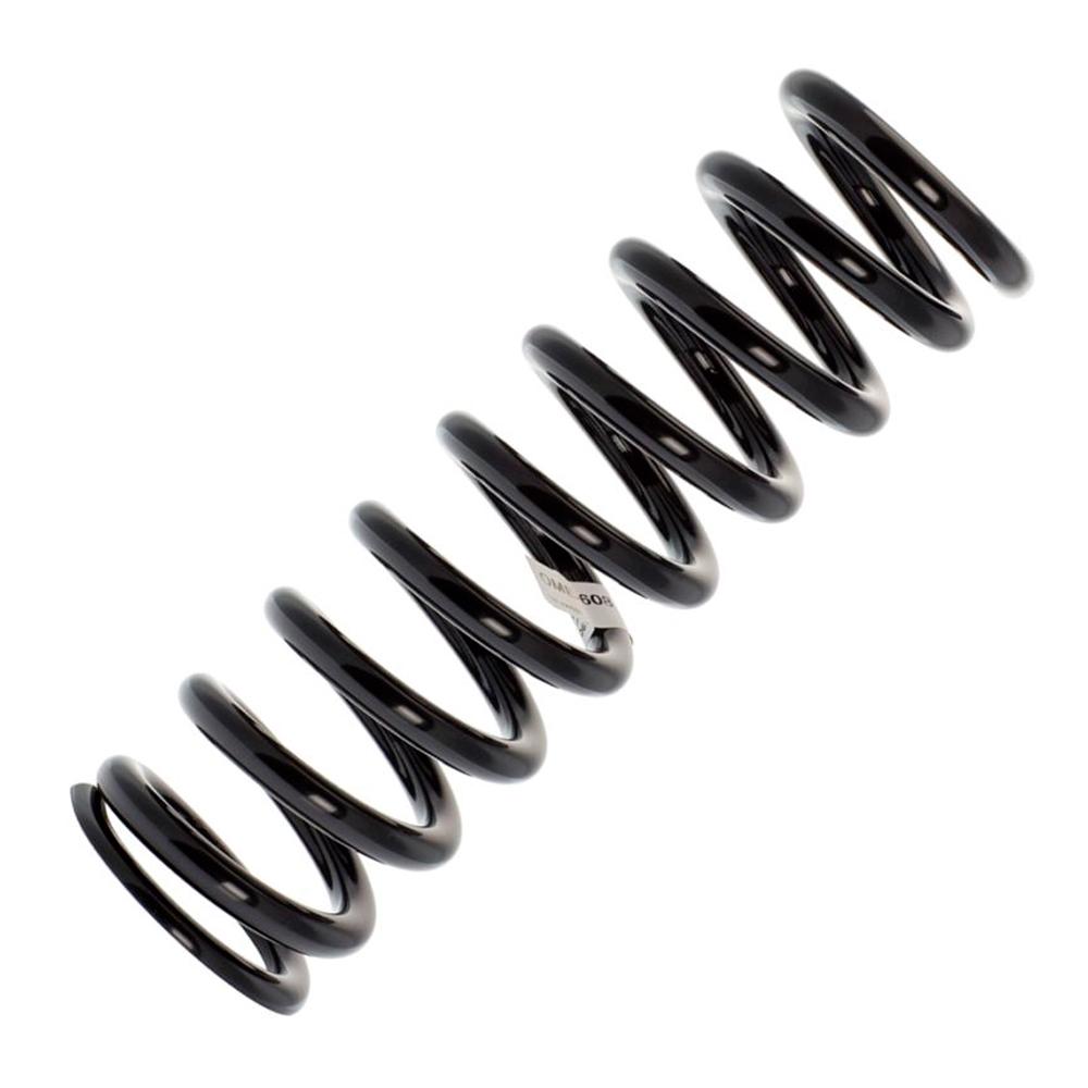 A black Old Man Emu coil spring on a white background, perfect for easy installation and adjusting ride height.