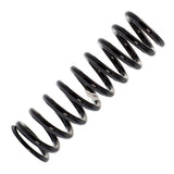 A black Old Man Emu coil spring on a white background, perfect for easy installation and adjusting ride height.