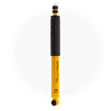 A yellow and black Old Man Emu Rear Nitrocharger Sport Shock Absorber 60100 for Toyota Tundra (2007-2021) with impressive shock absorber performance on a white background.
