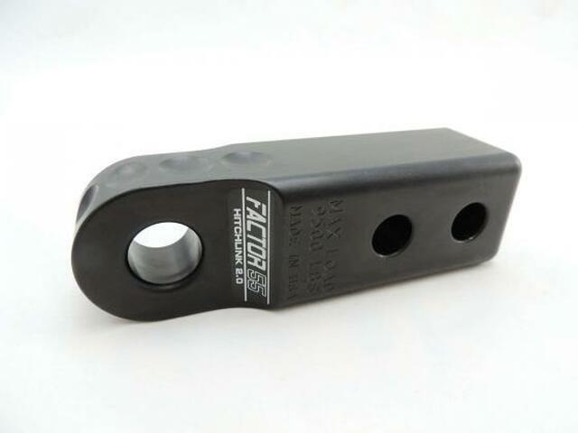 A powder coated black Factor 55 HitchLink 2.0in 00020-04 with holes on it, designed specifically for an aluminum hitchlink with a 9500 lb capacity.