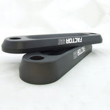 A pair of black Factor 55 sway bars on a white surface.