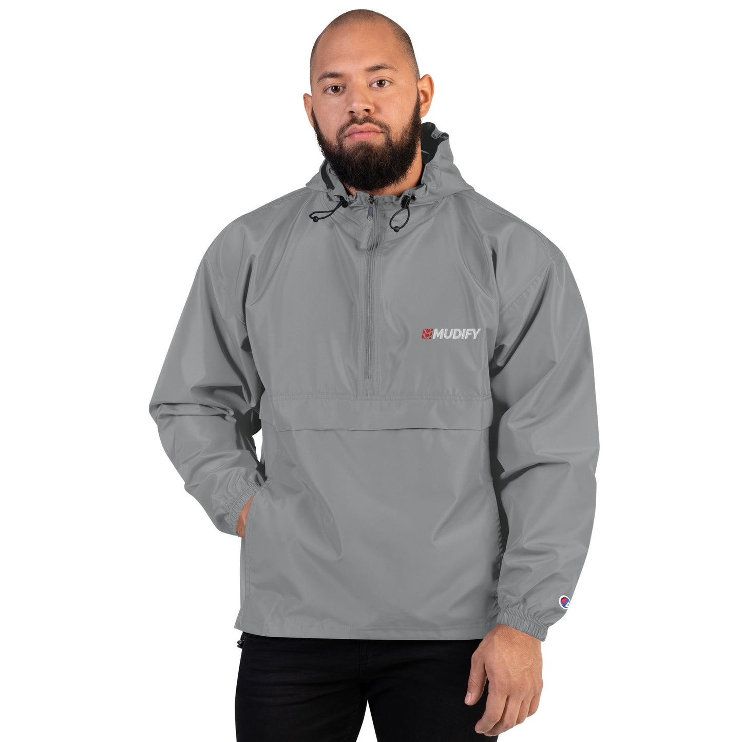 The Mudify packable jacket is perfect for braving wind and rain, featuring a stylish grey anorak design.