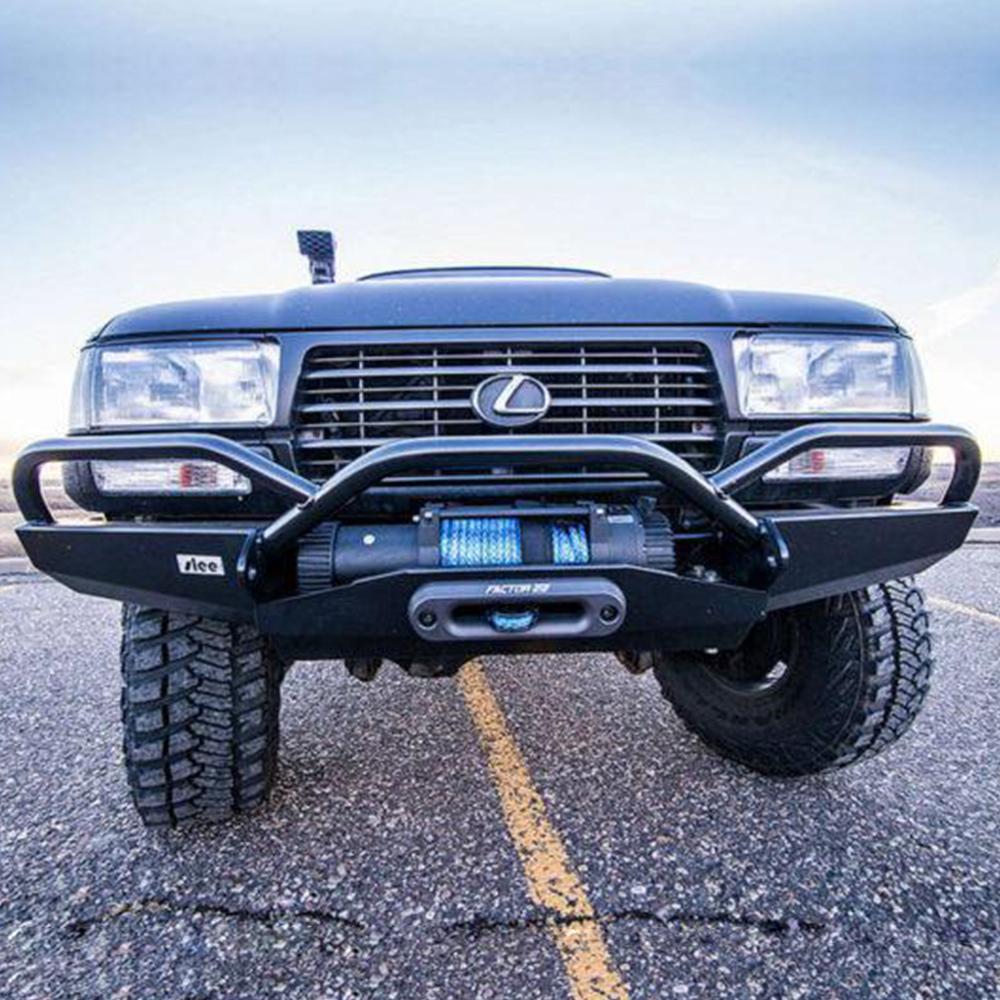 The front end of a black truck with a high capacity bumper, featuring the Factor 55 Hawse Fairlead 1.0" Gunmetal 00016, providing oxidation protection and easy use.