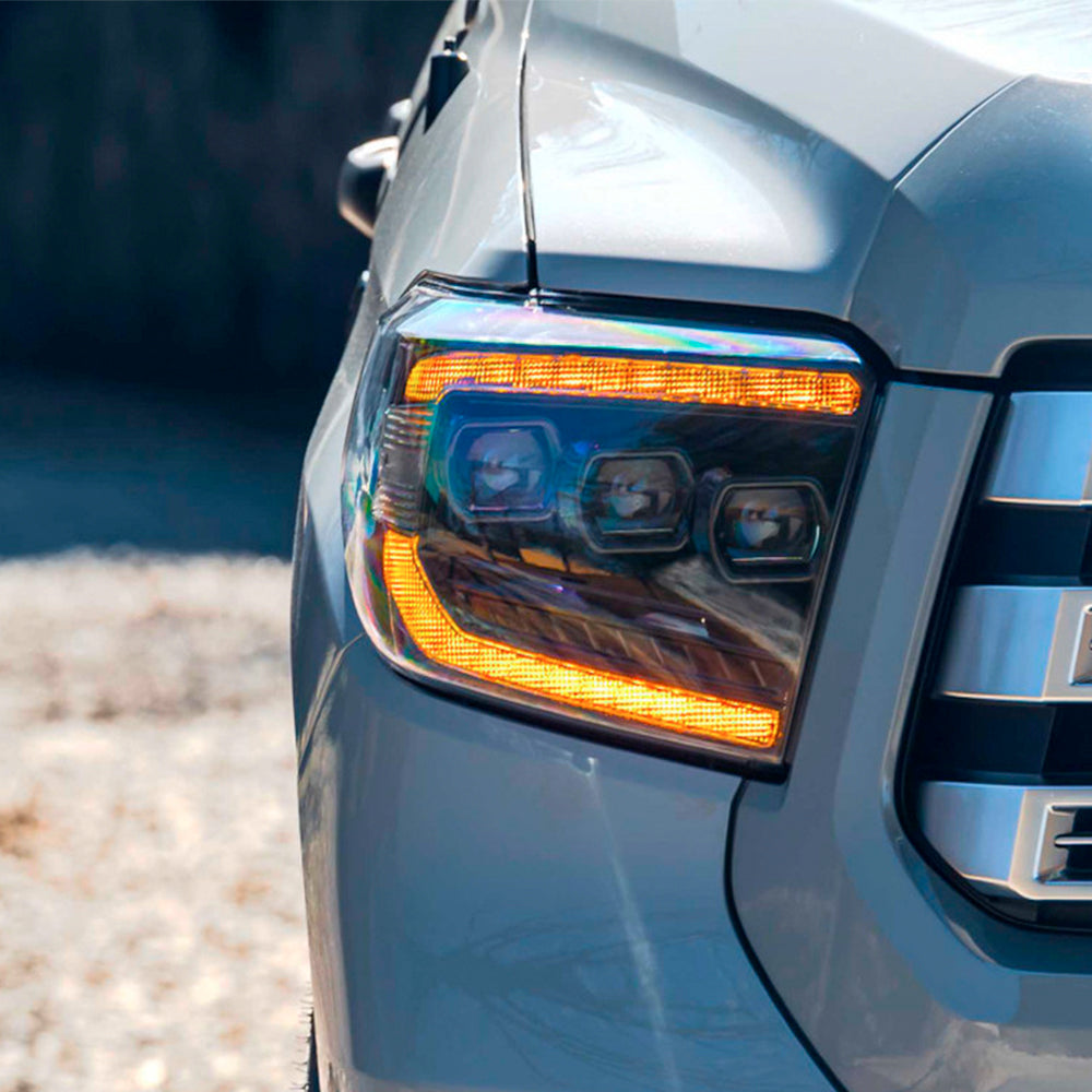 A close up of the Morimoto XB LED headlights LF532.2-ASM on a Tundra truck with impressive light output.