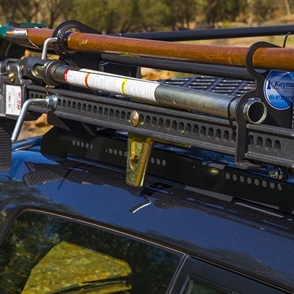 A car outfitted with an ARB Steel Basket Rack Kit 87" X 44" for Land Cruiser 200 Series 2008 - 2021 (ARB 3800040KLC2) for high capacity fishing gear transportation.