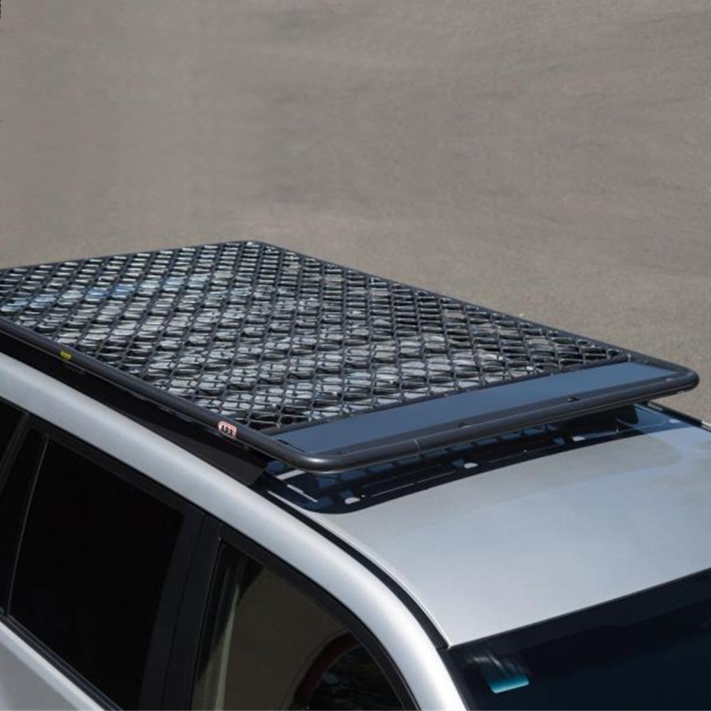 A high capacity ARB silver SUV with an ARB Steel Flat Rack 70” X 44” for Toyota 4Runner 2003-2009 on top, made of high quality materials.