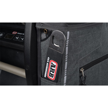 Load image into Gallery viewer, An ARB Protective Cover Transit Bag Canvas for 50 Quarts ARB Fridge Freezers 10900013 with a bottle opener attached to it, designed to protect and transport cold items like bottles in a convenient gray bag.