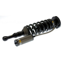 Load image into Gallery viewer, An Old Man Emu shock absorber for a car with the OME BP-51 Coil Over Front BP5160022 spring on it and an Old Man Emu shock absorber body.