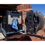 The back of a SUV with an ARB Zero 101 Quart Dual Zone Portable Fridge Freezer 10802962 in it, offering a versatile capacity.