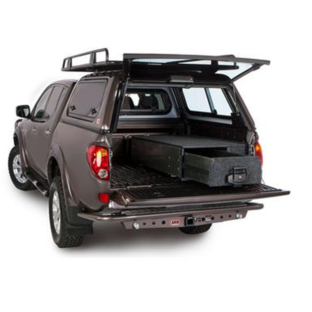 The ARB Outback Solutions Roller Floor RFH1355, a water resistant storage compartment of a pickup truck, providing maximum security for off-road driving journeys.