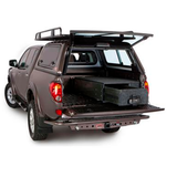 The ARB Outback Solutions Roller Floor RFH1355, a water resistant storage compartment of a pickup truck, providing maximum security for off-road driving journeys.