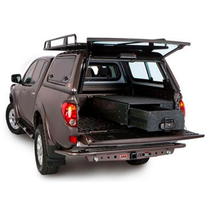 Load image into Gallery viewer, The ARB Outback Solutions Roller Floor RFH1355, a water resistant storage compartment of a pickup truck, providing maximum security for off-road driving journeys.