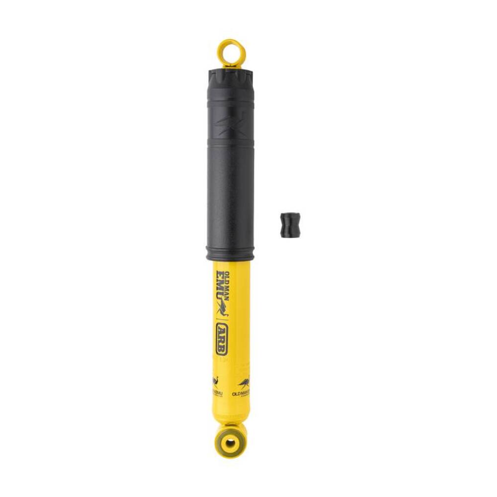 A yellow and black Old Man Emu shock absorber with impeccable Old Man Emu shock absorber performance on a white background.