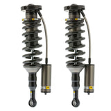 A pair of Old Man Emu BP-51 Front Shock Absorbers for the Toyota Tacoma featuring a remote reservoir for enhanced performance.