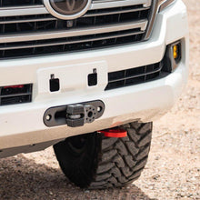Load image into Gallery viewer, The white Toyota Land Cruiser features a sturdy steel front bumper equipped with ARB Recovery Point 8T 2815020, ensuring both durability and enhanced visibility.