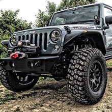 Load image into Gallery viewer, A gray jeep with a Warn 89611 ZEON 10-S Winch with Synthetic Rope - 10000 lb. Capacity by Factor 55 parked on a dirt road.
