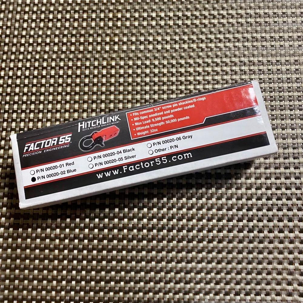 A box with a Factor 55 HitchLink 2.0 00020-02 label on it, featuring the keywords "made in USA" and "9500LB capacity".