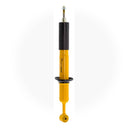 A yellow Old Man Emu shock absorber with compression valving on a white background.