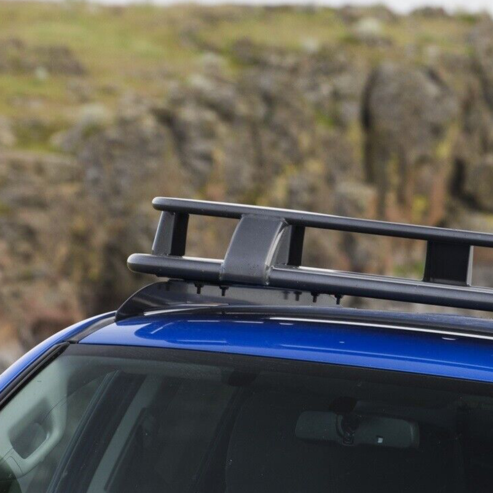 A blue car with an ARB Roof Rack Mounting Kit 3723010 for Toyota Tacoma 2005-2022.