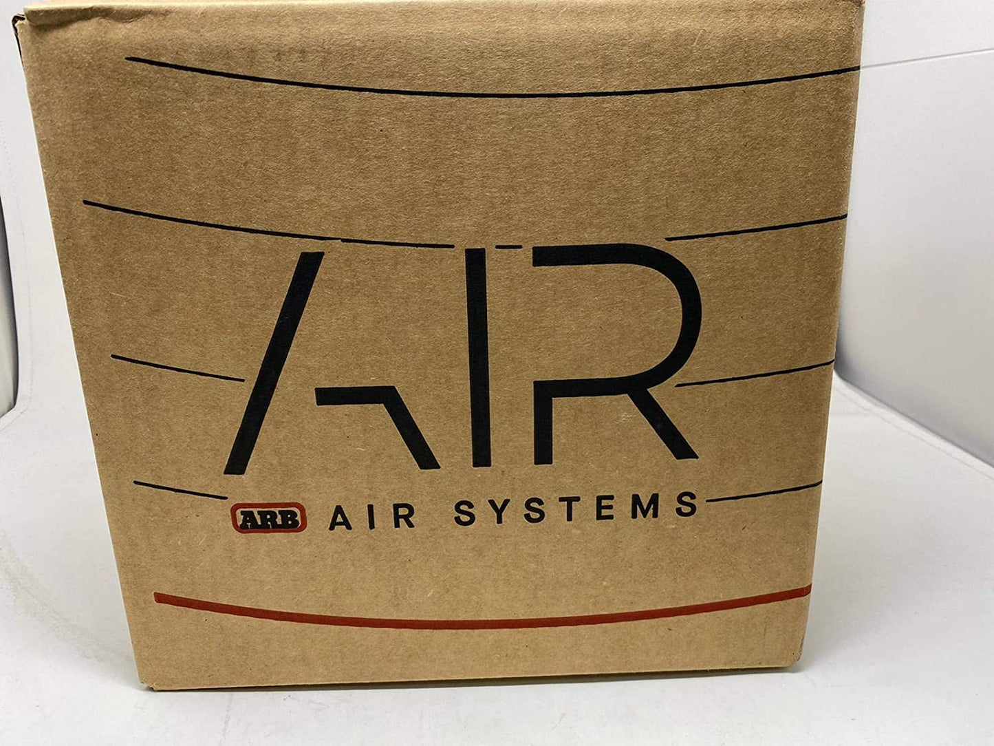 A high capacity ARB Inflation Kit Air Compressor and Orange Air Hose Pump Up Kit with Quick Fitting Bundle On Board System, CKMA12 and 171302 Part Numbers in a New ARB Printed Box (Compressor & Inflation Kit), offering oxidation protection and easy plug-in connectivity.