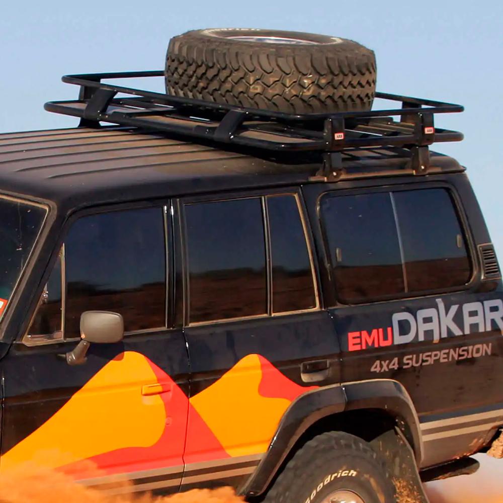 A ARB Roof Rack Fitting Kit 43" x 49" for Toyota Land Cruiser 1980 - 1990 ARB 3700040 equipped with a secure storage fitting kit on top, offering high capacity.