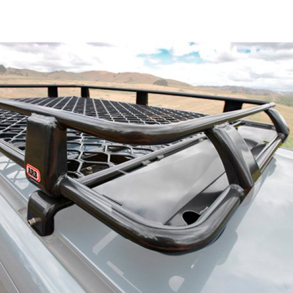 A black ARB Steel Basket Rack With Mesh Floor 87” X 44” for Toyota Land Cruiser 200 Series 2008 - 2020, complete with a steel support channel, installed on top of a car.