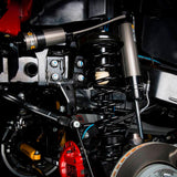 A close up of a Old Man Emu motorcycle suspension system featuring an OME BP-51 Coil Over Front BP5160021 shock absorber body for Jeep Wrangler JK.