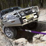 An ARB Toyota Land Cruiser is stuck in a rocky area and requires an ARB Winch Extension Strap ARB725LB for recovery.