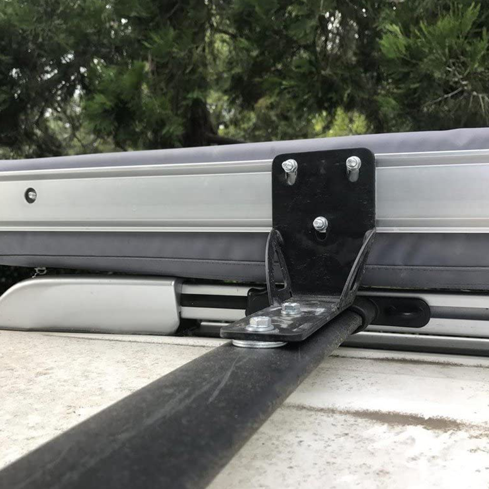 A roof rack with ARB Universal Awning Bracket for Most Roof Racks OS850 attached to the side of a vehicle.