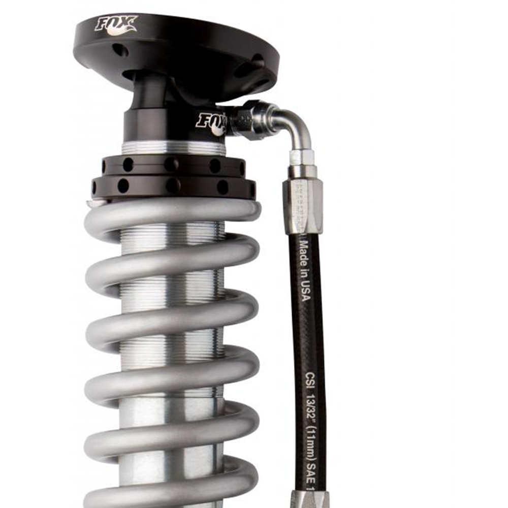 A Fox Racing zinc-plated coil spring on a white background.