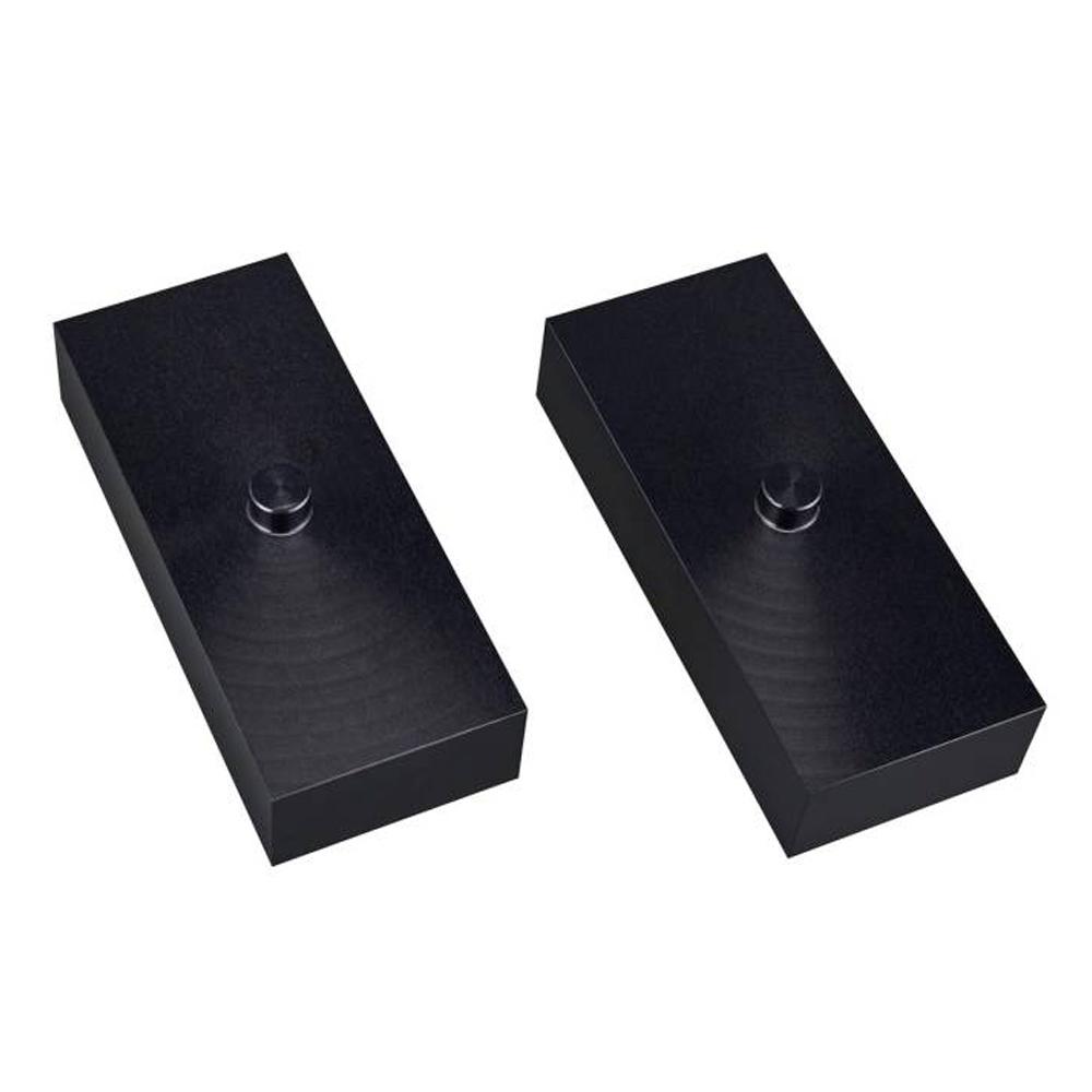 A pair of Old Man Emu Leaf Spring Spacer 3460023 on a white background with excellent load capacity and spring longevity.