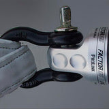 A close up of a Factor 55 Shackle Mount in Silver 00015-05 with a leather strap.