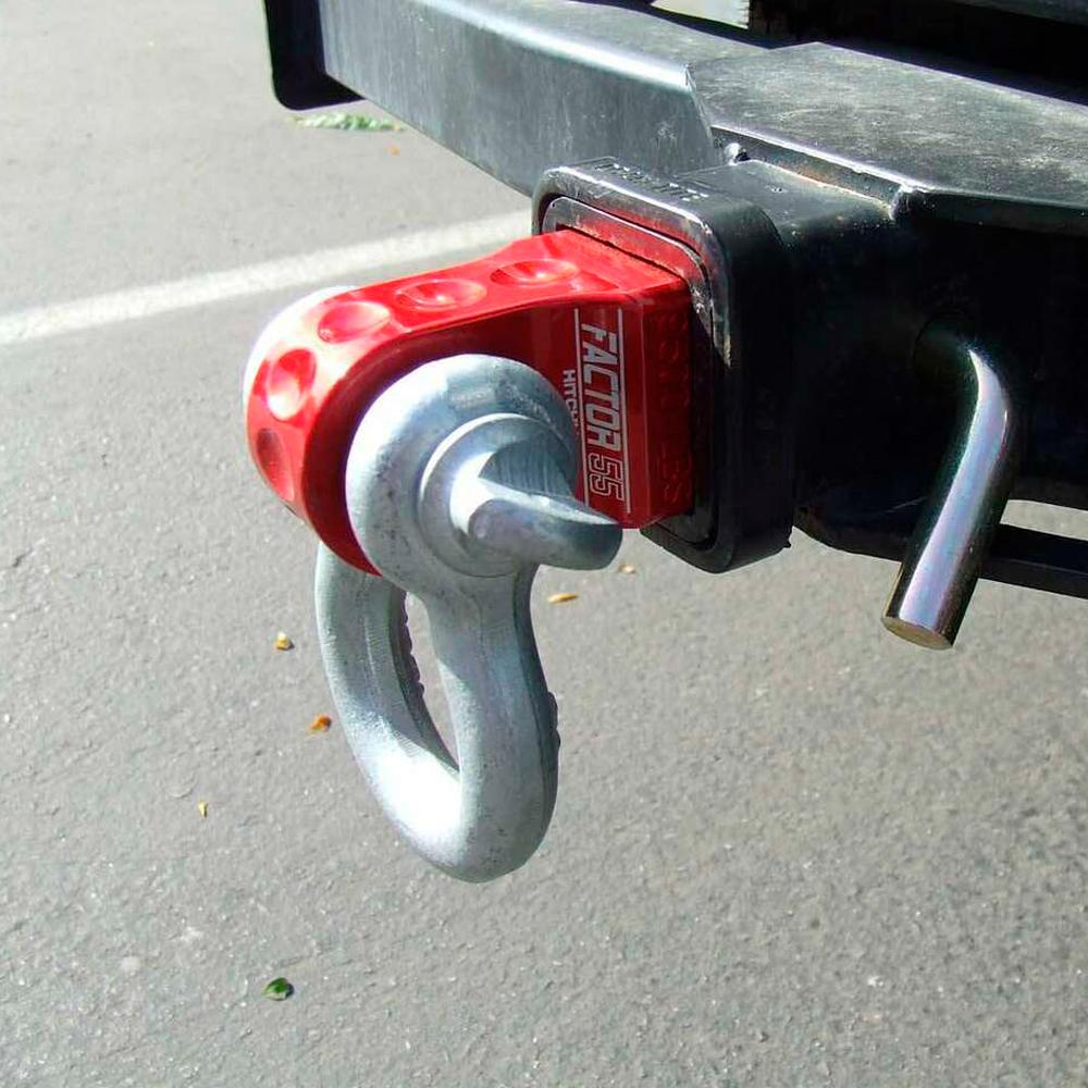 A red, Factor 55 HitchLink 2.0 00020-02 attached to the back of a truck with a 9500LB capacity.