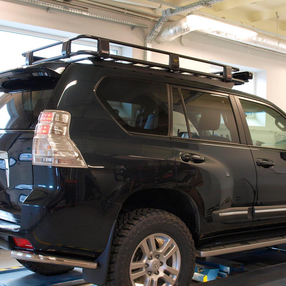 A high capacity black ARB SUV with secure storage in a garage.
