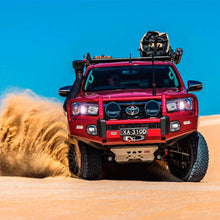 Load image into Gallery viewer, A red Toyota Tacoma with easy installation of Old Man Emu Rear Coil Springs 2896 for Prado150 Series, FJ Cruiser, 4Runner - Constant Load 440 lbs is driving through the sand dunes.
