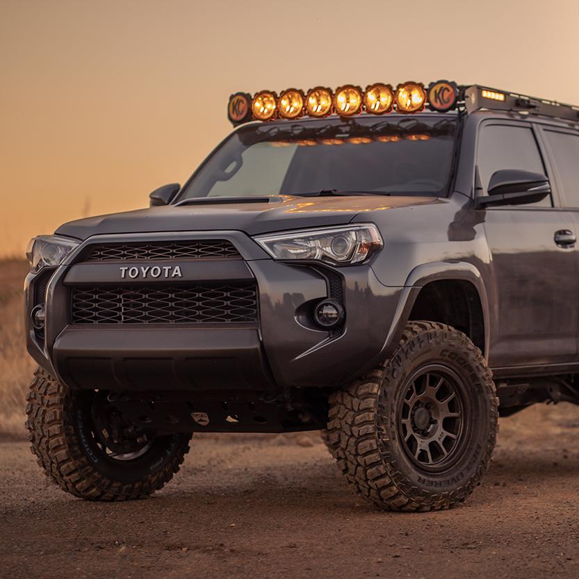 The 2019 Old Man Emu Toyota 4Runner, equipped with the OME BP-51 suspension system and shock absorbers, is shown traversing the desert.