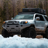 An Old Man Emu OME BP-51 2.5 - 3 inch Lift Kit for 4Runner (03-09) is parked in the snow.