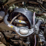 A car with Old Man Emu ARB UCA0005 Upper Control Arms for Toyota Tacoma (2005-2023) suspension lift and caster and camber adjustment.