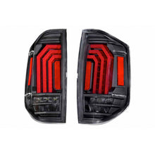 Load image into Gallery viewer, Enhance your Ford F-150 with a vibrant pair of aftermarket Morimoto Xb Led Tails LF705 for Toyota Tundra (2014 - 2021). These high-performance black and red tail lights are the perfect addition to make your truck stand out on.