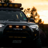 The Morimoto XB LED headlights for Toyota 4Runner (2014-2023) enhance the front end of a Toyota 4Runner at sunset, making it stand out as a stylish and eye-catching aftermarket modification.