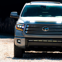 Load image into Gallery viewer, The front end of a gray Toyota Tundra with Morimoto XB Led Headlights LF532.2-ASM.