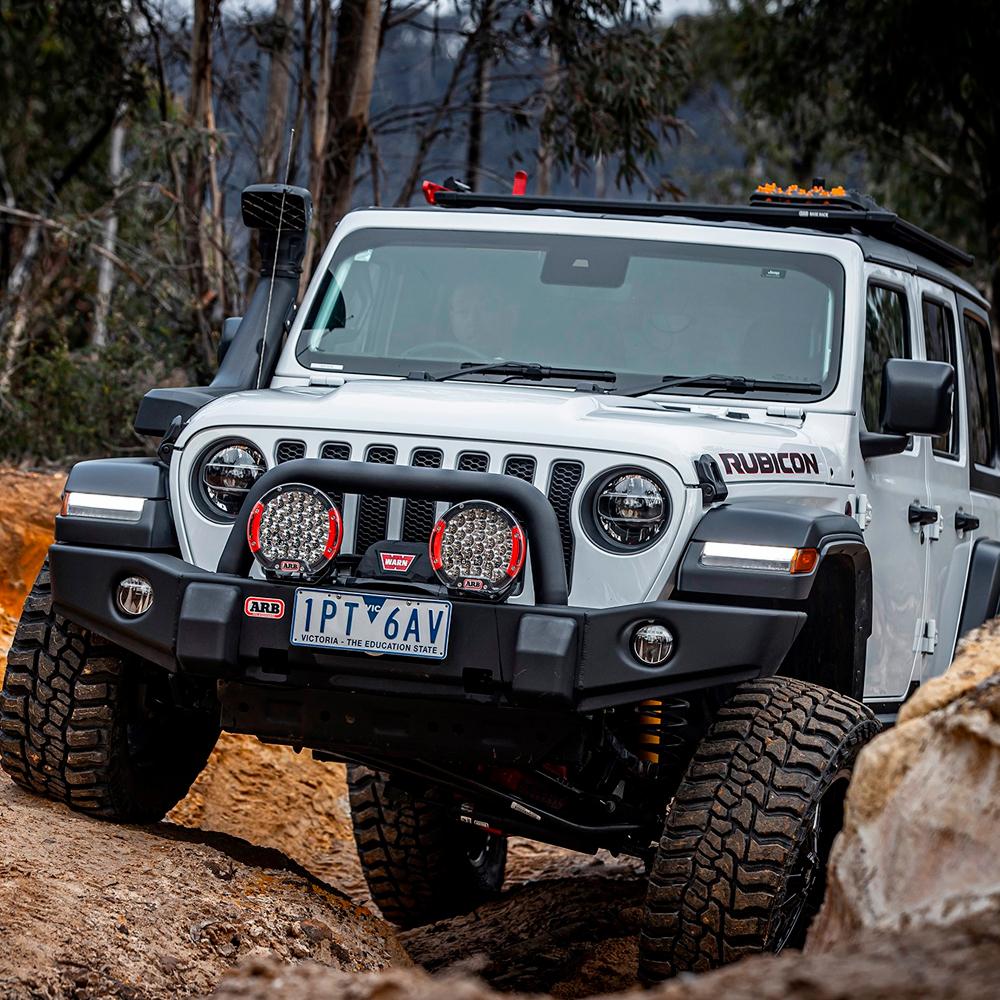 The ARB 4913020MKJL Alloy Flat Roof Rack 70" x 44" with Mesh Floor for Jeep Wrangler JL 2018-2019 is equipped with a secure storage compartment and comes with a fitting kit for easy installation.