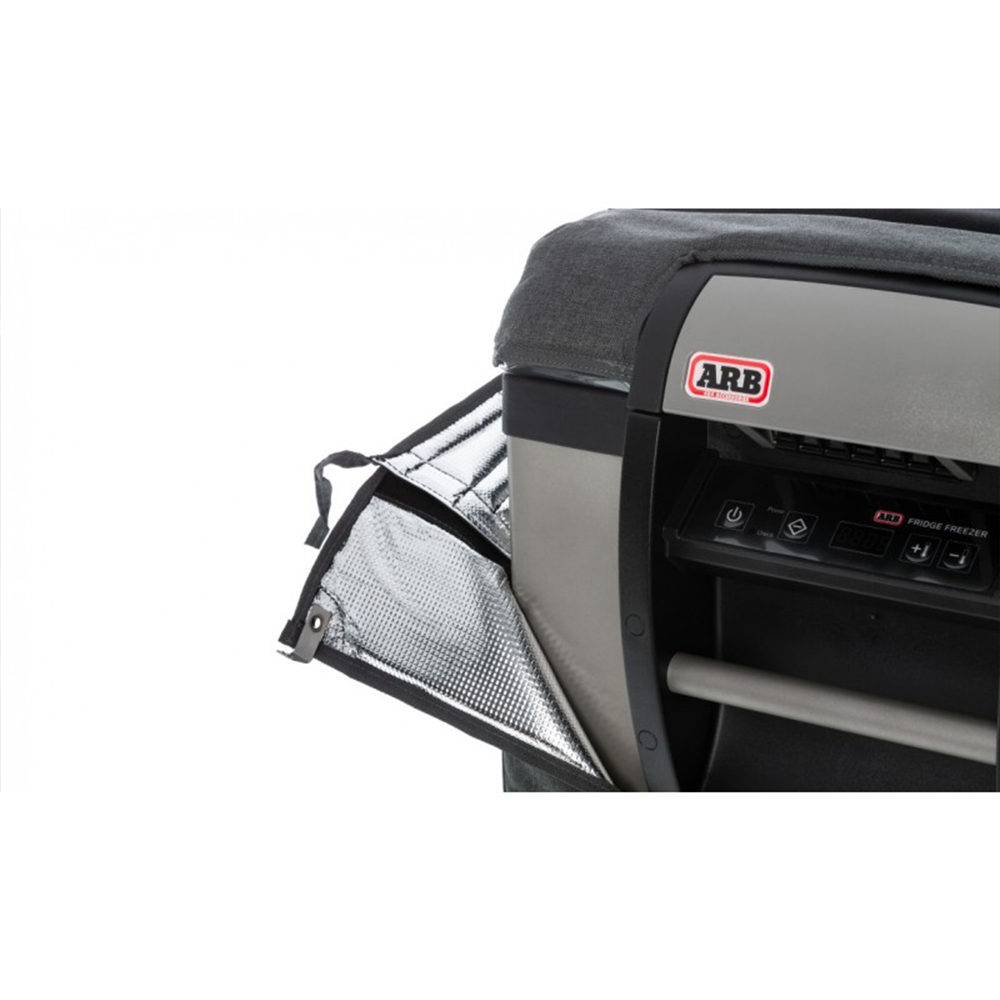 A car with a seat and an ARB Protective Cover Transit Bag Canvas for 50 Quarts ARB Fridge Freezers 10900013 that protect.