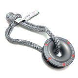 A Factor 55 Rope Retention Pulley Snatch Block 00260, perfect for a soft shackle, with a gray rope and a red dot on it.