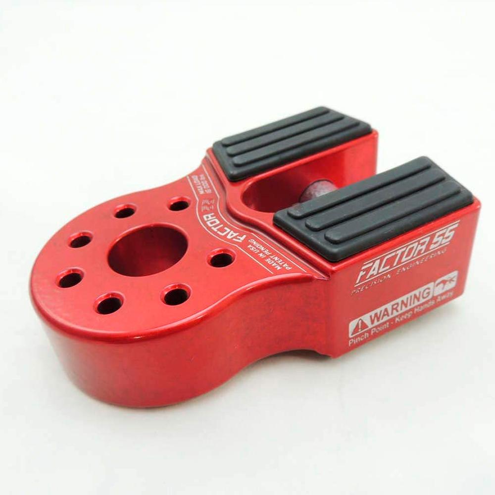 A red bike handlebar clamp with black holes, featuring the Factor 55 FlatLink Winch Shackle Mount 00050-01.