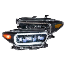 Load image into Gallery viewer, Upgrade your Toyota Tacoma with Morimoto XB LED headlights LF530.2 ASM for enhanced visibility and a sleek aftermarket look. These high-quality Morimoto XB LED headlights LF530.2 ASM are specifically designed to fit the Toyota Tacoma, providing improved illumination and adding